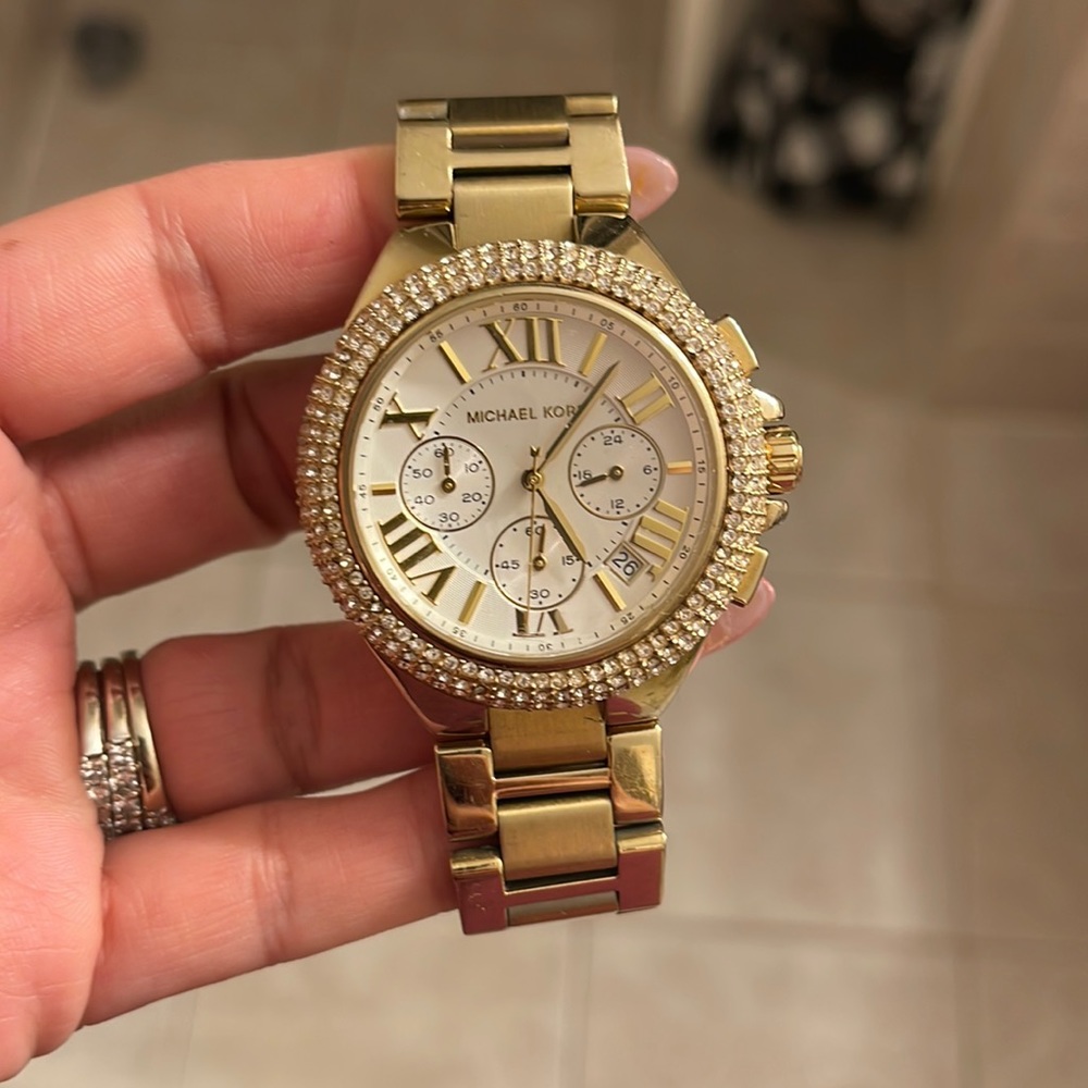 Gold stainless steal lightly used Michael Kors glitzy watch!